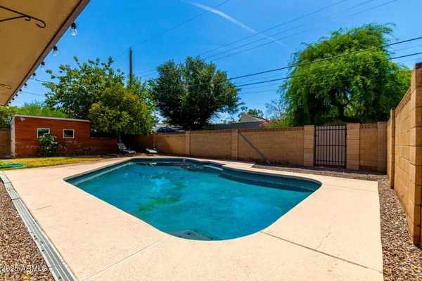 a view of a swimming pool with an outdoor space