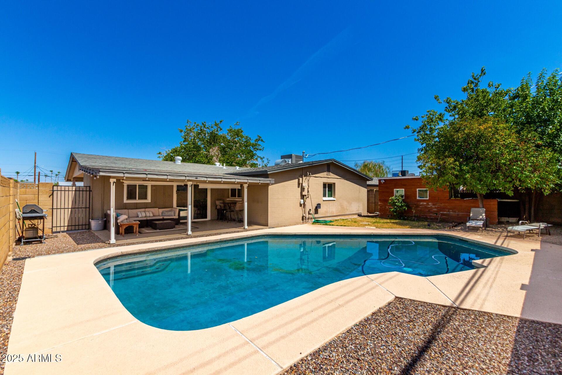 2100 North Normal Avenue Tempe, AZ 85288 - Photo 29 of 51 a view of a house with pool and chairs