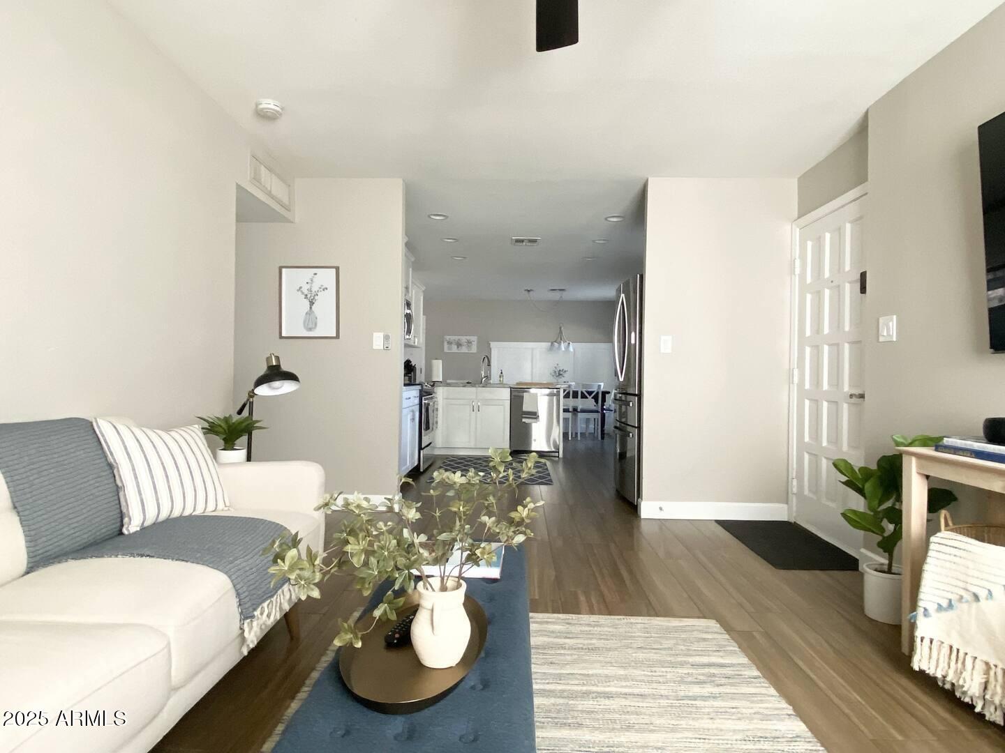 2100 North Normal Avenue Tempe, AZ 85288 - Photo 38 of 51 a living room with furniture and a wooden floor