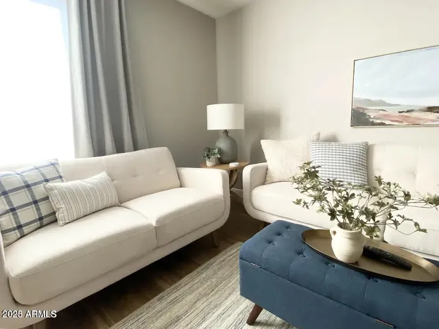 a room with chairs and wooden floor