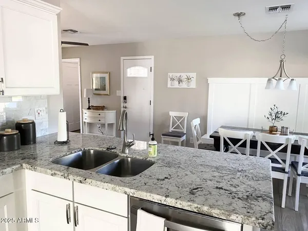 a stove top oven sitting inside of a kitchen