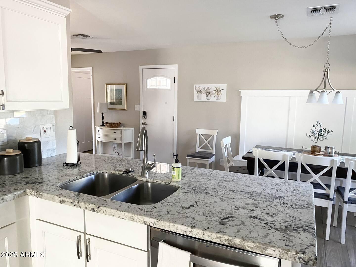 2100 North Normal Avenue Tempe, AZ 85288 - Photo 44 of 51 a kitchen with a counter top space a sink and cabinets