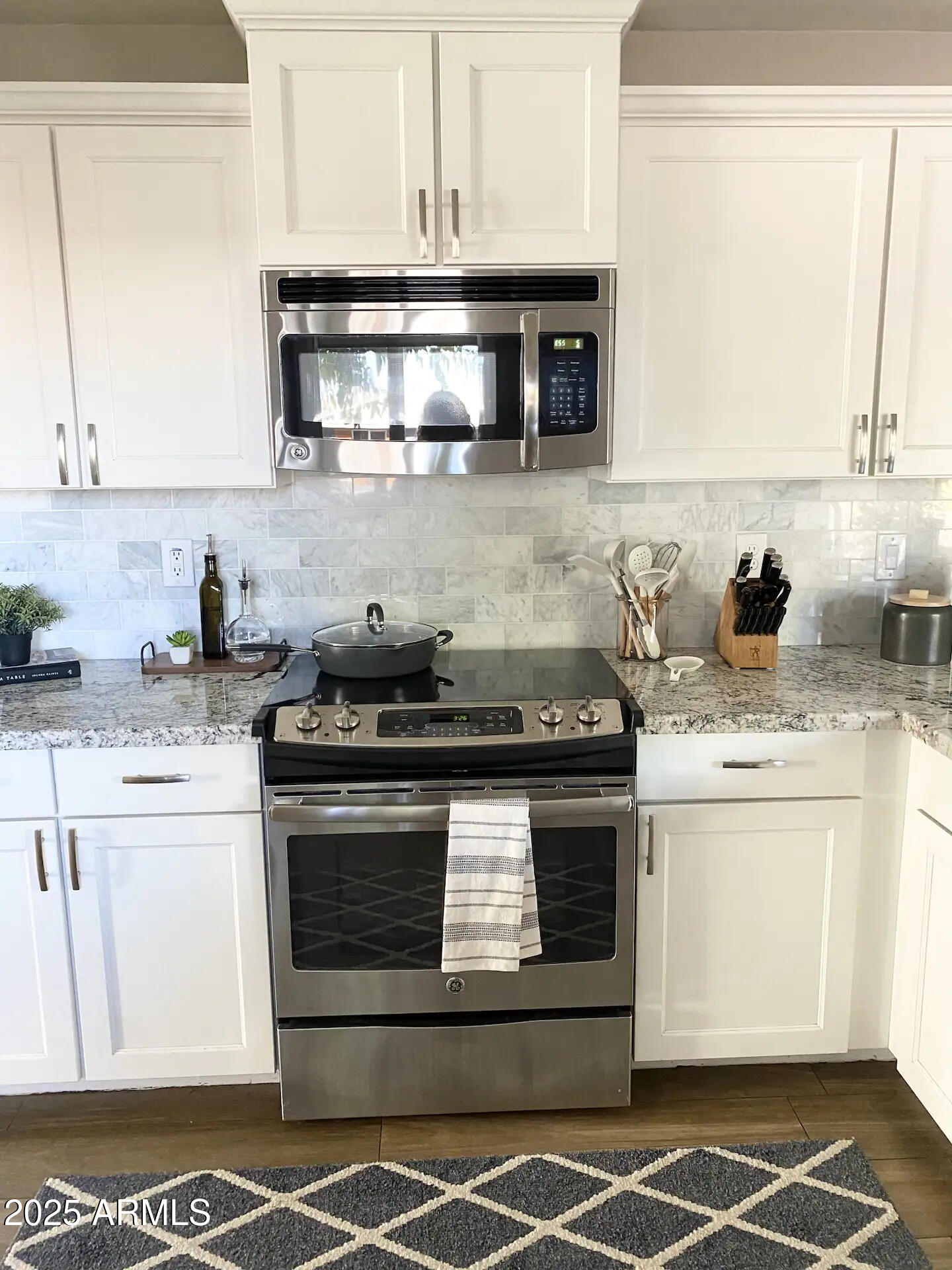 2100 North Normal Avenue Tempe, AZ 85288 - Photo 45 of 51 a stove top oven sitting inside of a kitchen