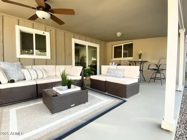 a living room with couches and a flat screen tv