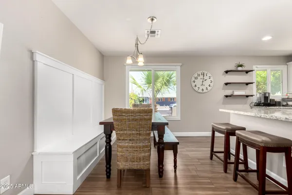 a dining room with furniture and window
