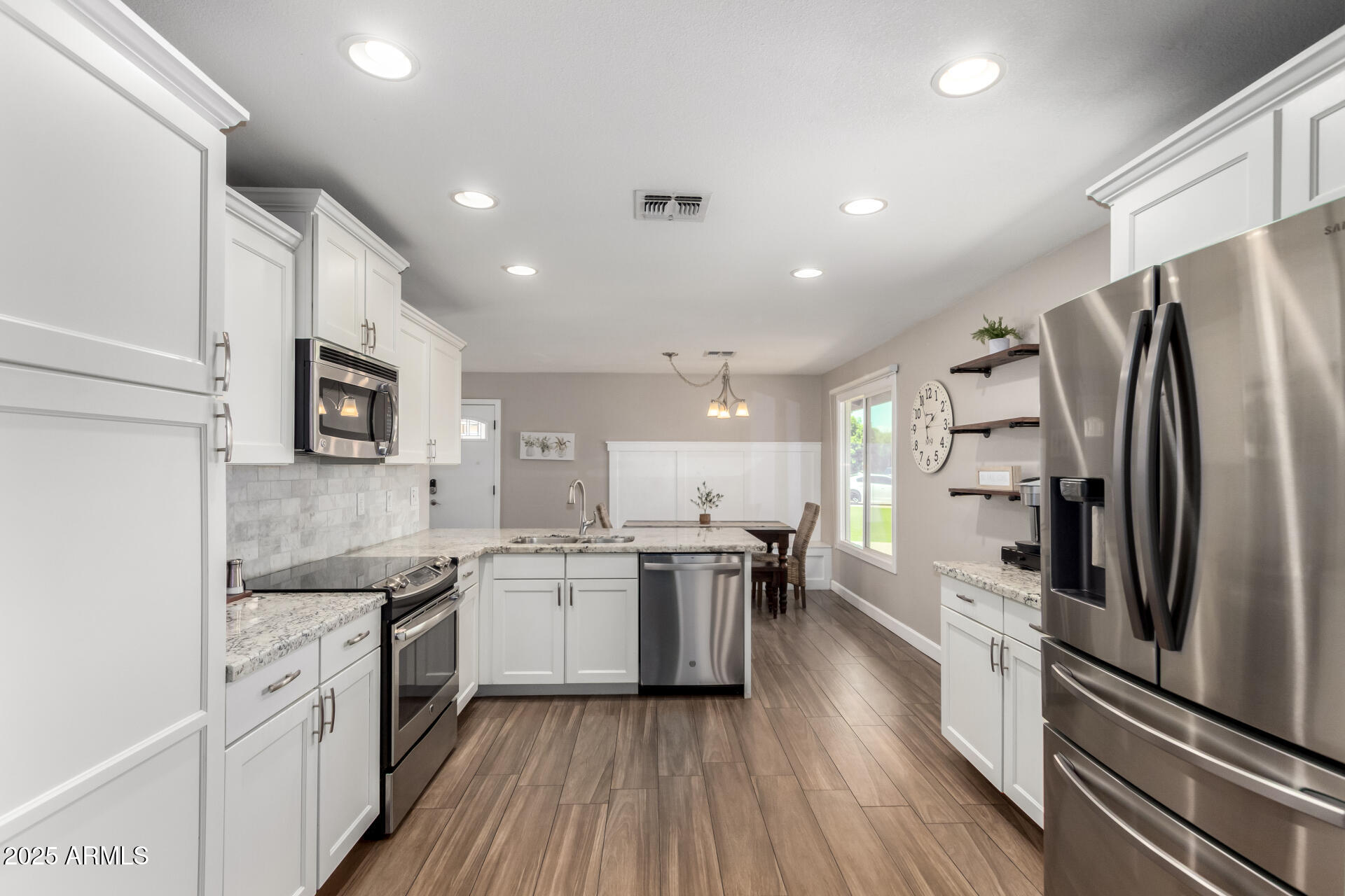 2100 North Normal Avenue Tempe, AZ 85288 - Photo 10 of 51 a kitchen with stainless steel appliances granite countertop a refrigerator a stove top oven a sink and dishwasher