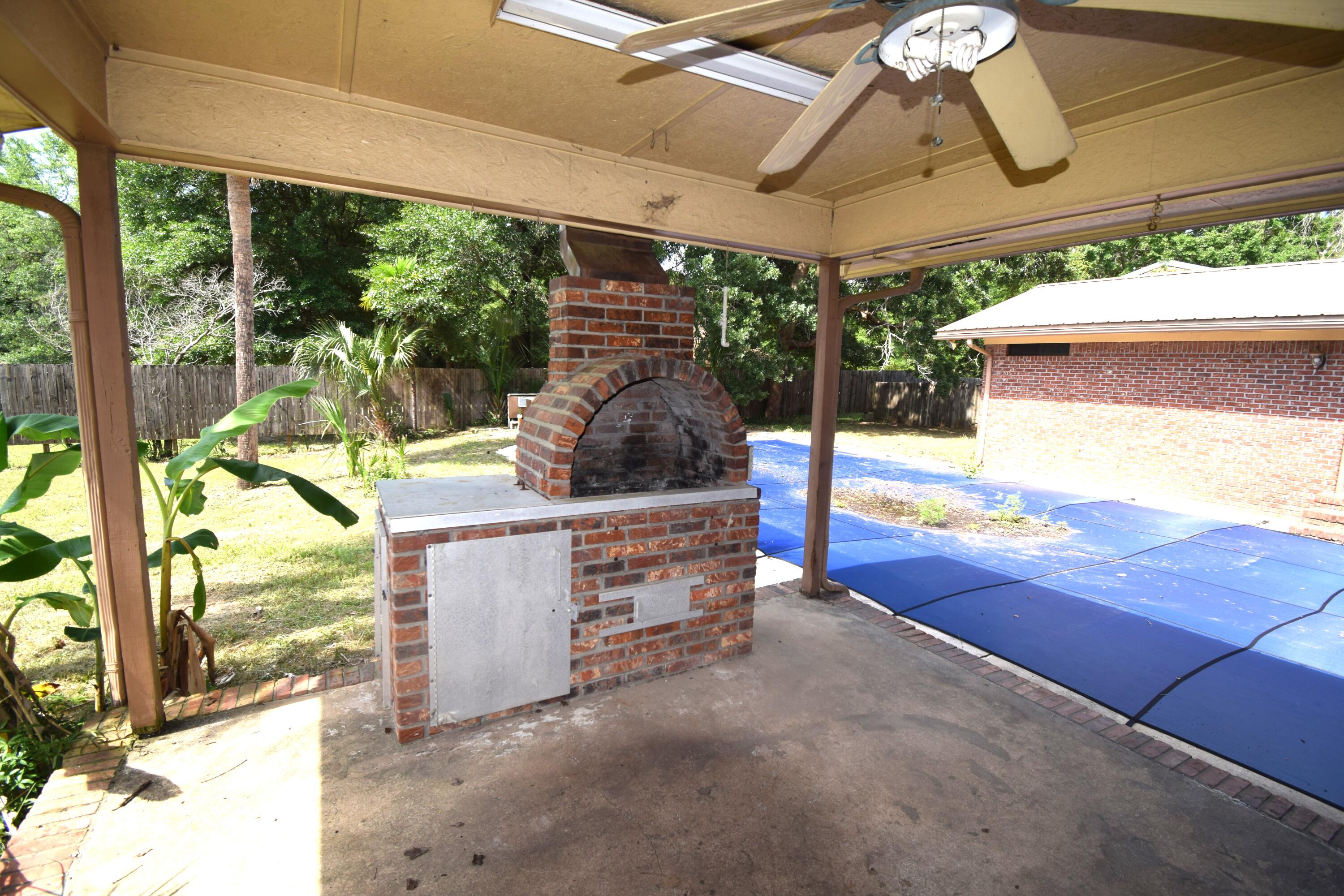 6047 Eden Square Crestview, FL 32539 - Photo 3 of 39 a view of a patio outdoor seating area