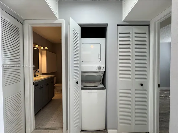 a view of a kitchen from a hallway