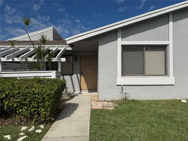 a front view of a house with garage