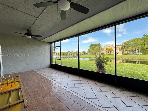 a view of an empty room with a large window