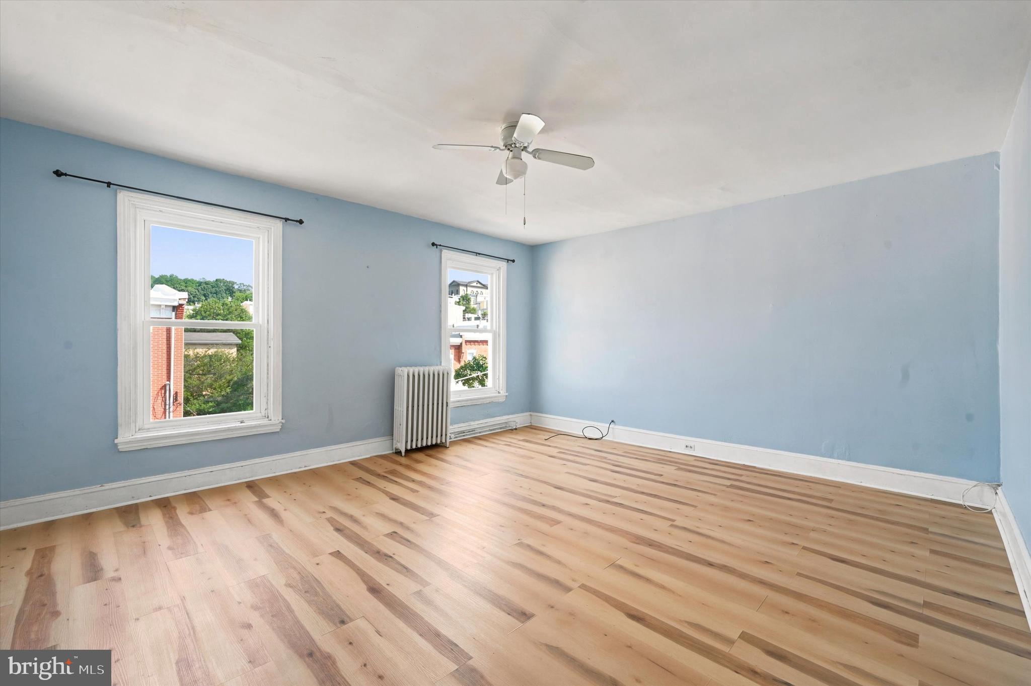 204 Ripka Street, Unit 2 Philadelphia, PA 19127 - Photo 10 of 22 wooden floor in an empty room with a window