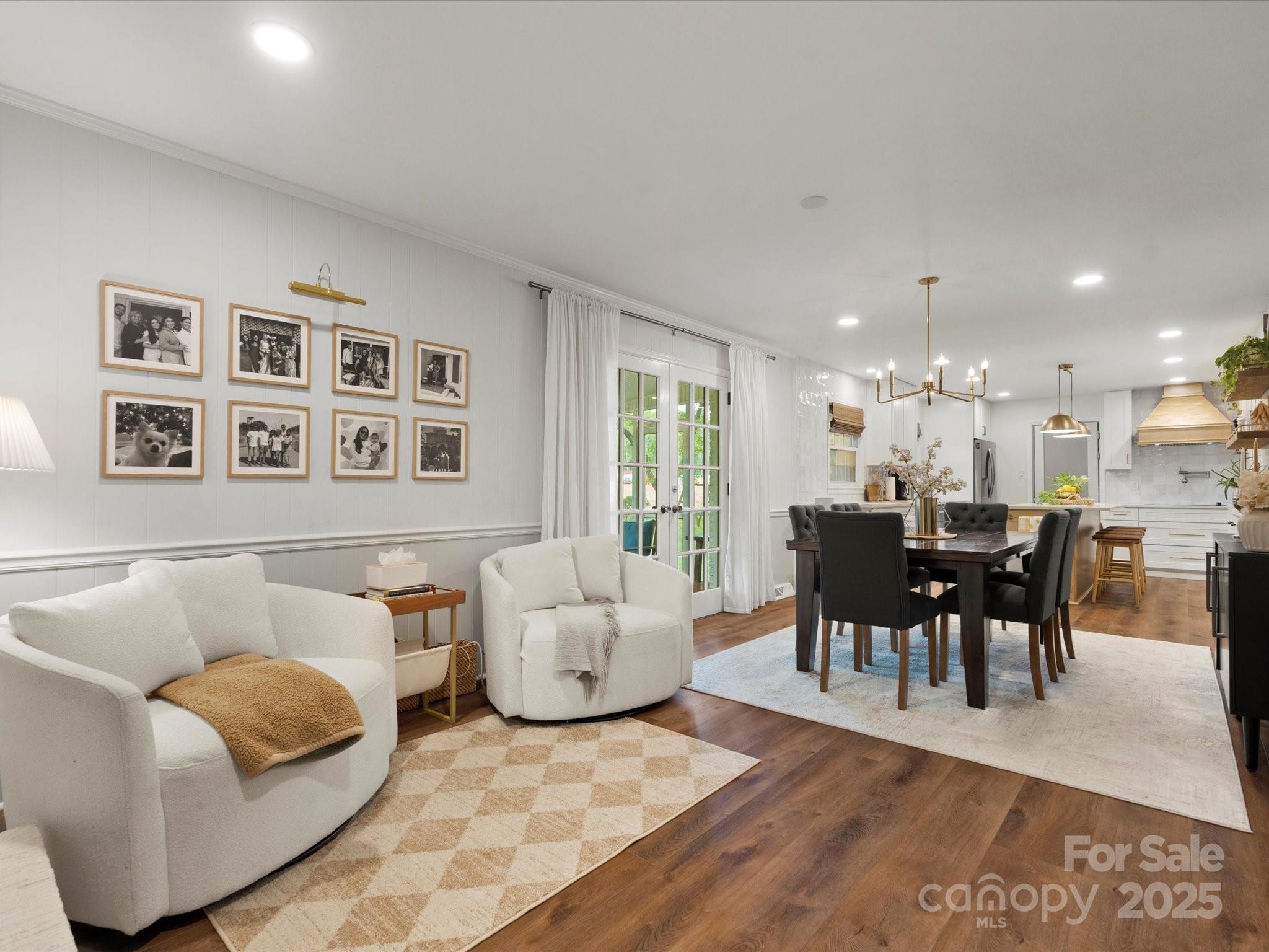 1102 Oak Hill Drive Monroe, NC 28112 - Photo 13 of 33 a living room with furniture and a dining table