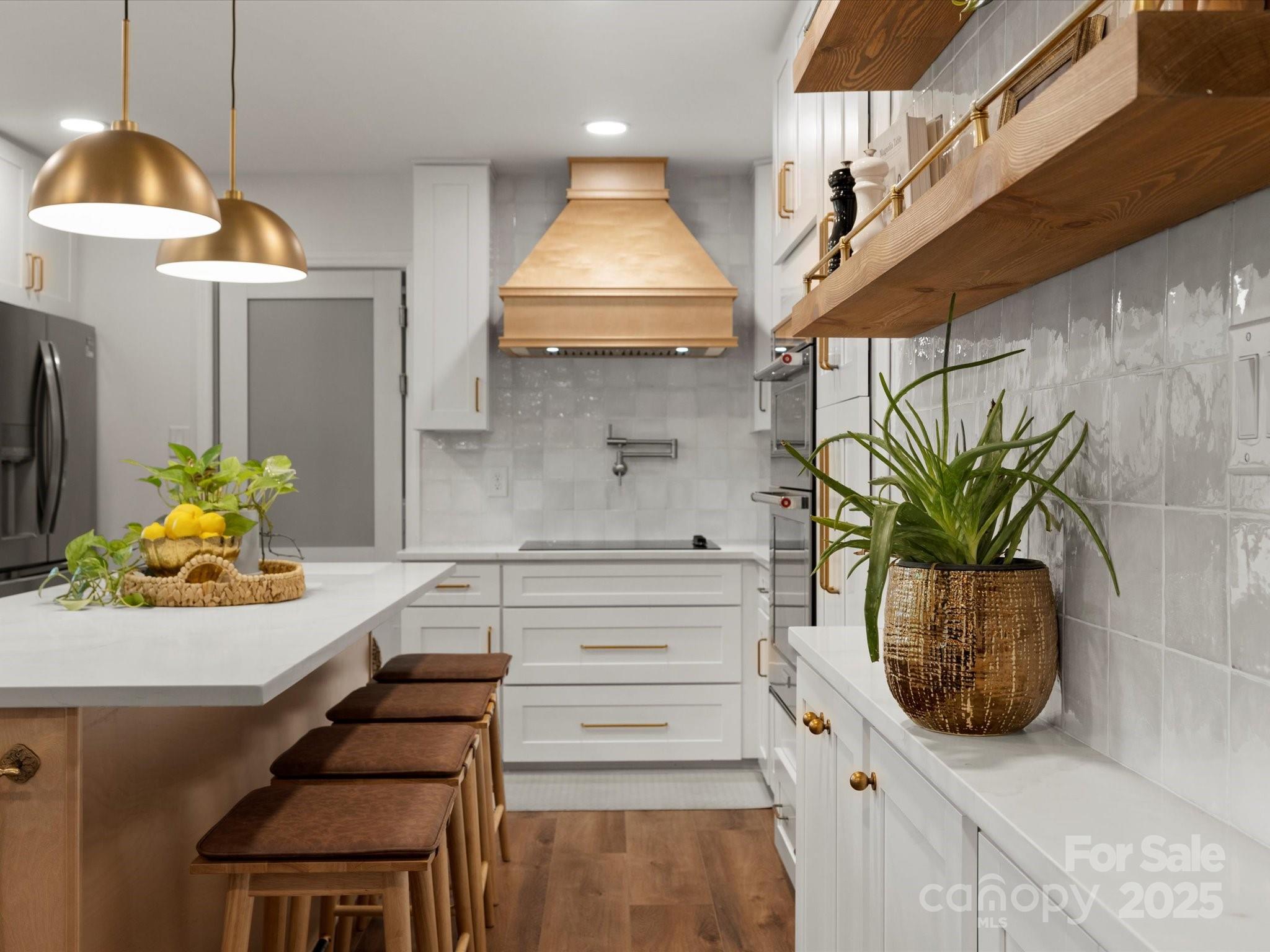 1102 Oak Hill Drive Monroe, NC 28112 - Photo 15 of 33 a kitchen with stainless steel appliances kitchen island granite countertop a table in it and a sink