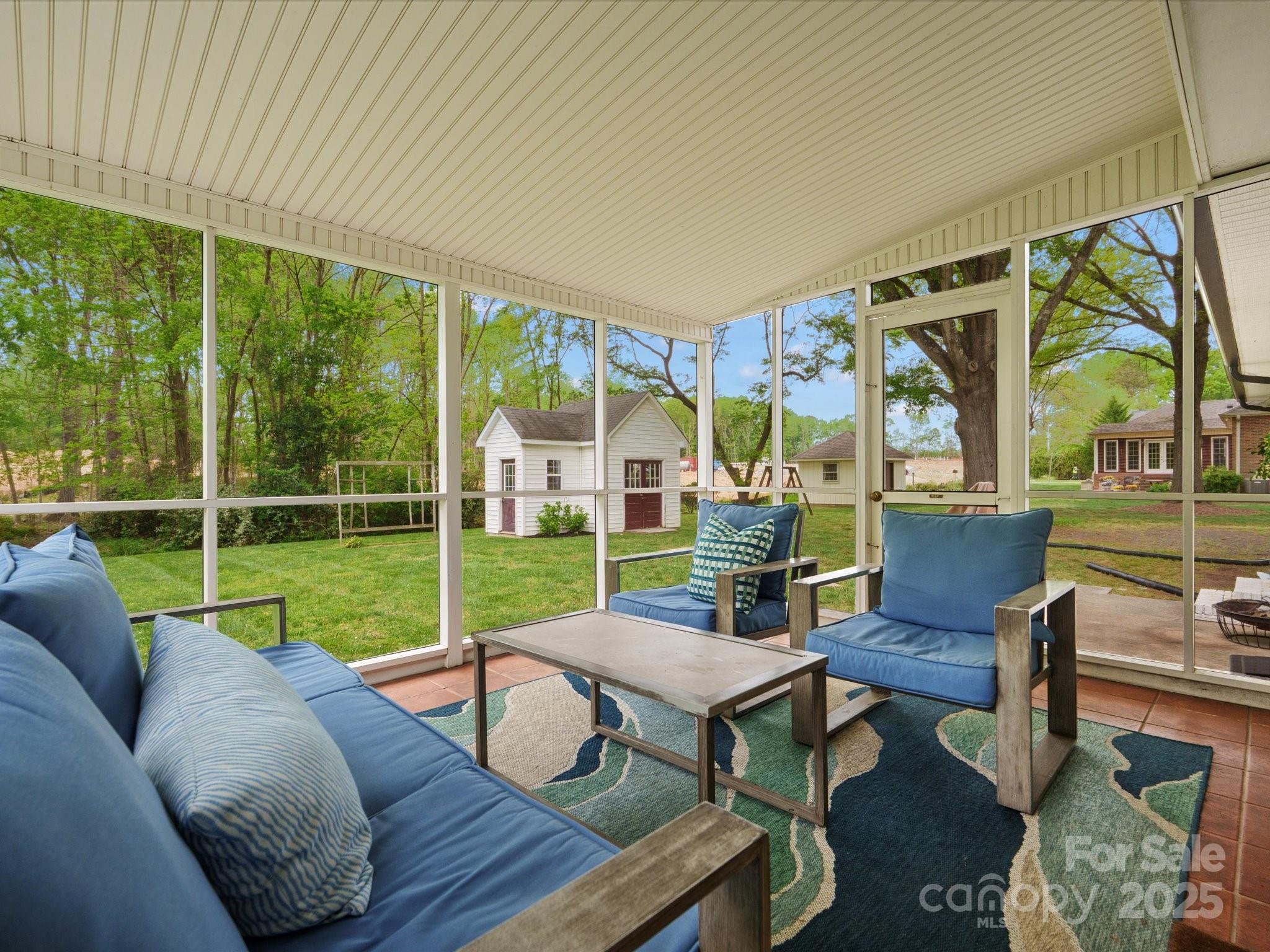 1102 Oak Hill Drive Monroe, NC 28112 - Photo 30 of 33 a view of a patio with couches chairs and a wooden floor