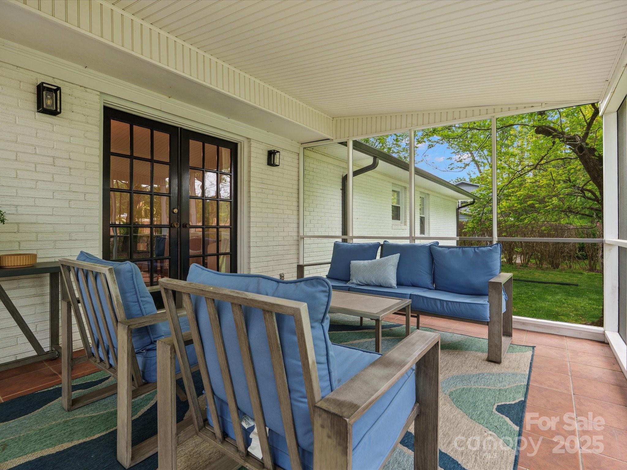 1102 Oak Hill Drive Monroe, NC 28112 - Photo 31 of 33 a view of a patio with table and chairs with wooden floor and fence