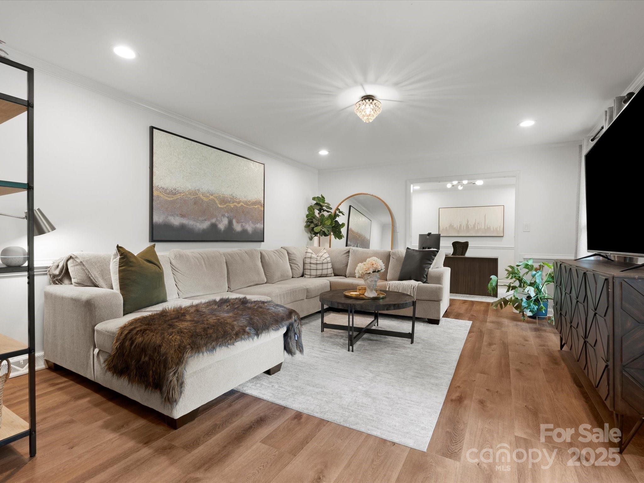 1102 Oak Hill Drive Monroe, NC 28112 - Photo 5 of 33 a living room with furniture and a flat screen tv