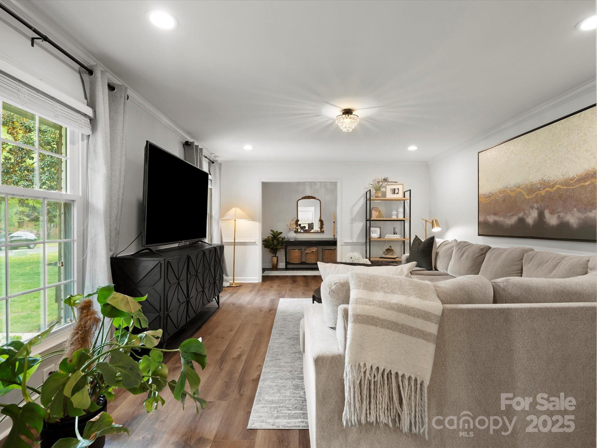 1102 Oak Hill Drive Monroe, NC 28112 - Photo 7 of 33 a living room with furniture and a flat screen tv