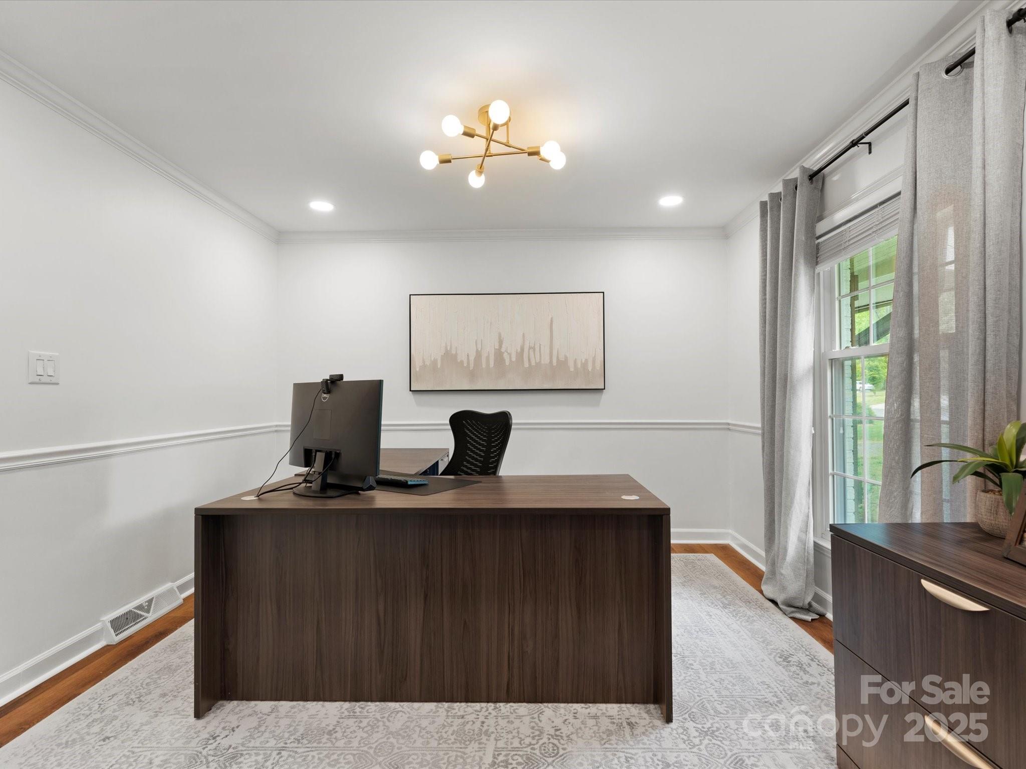 1102 Oak Hill Drive Monroe, NC 28112 - Photo 8 of 33 a living room with furniture and a flat screen tv