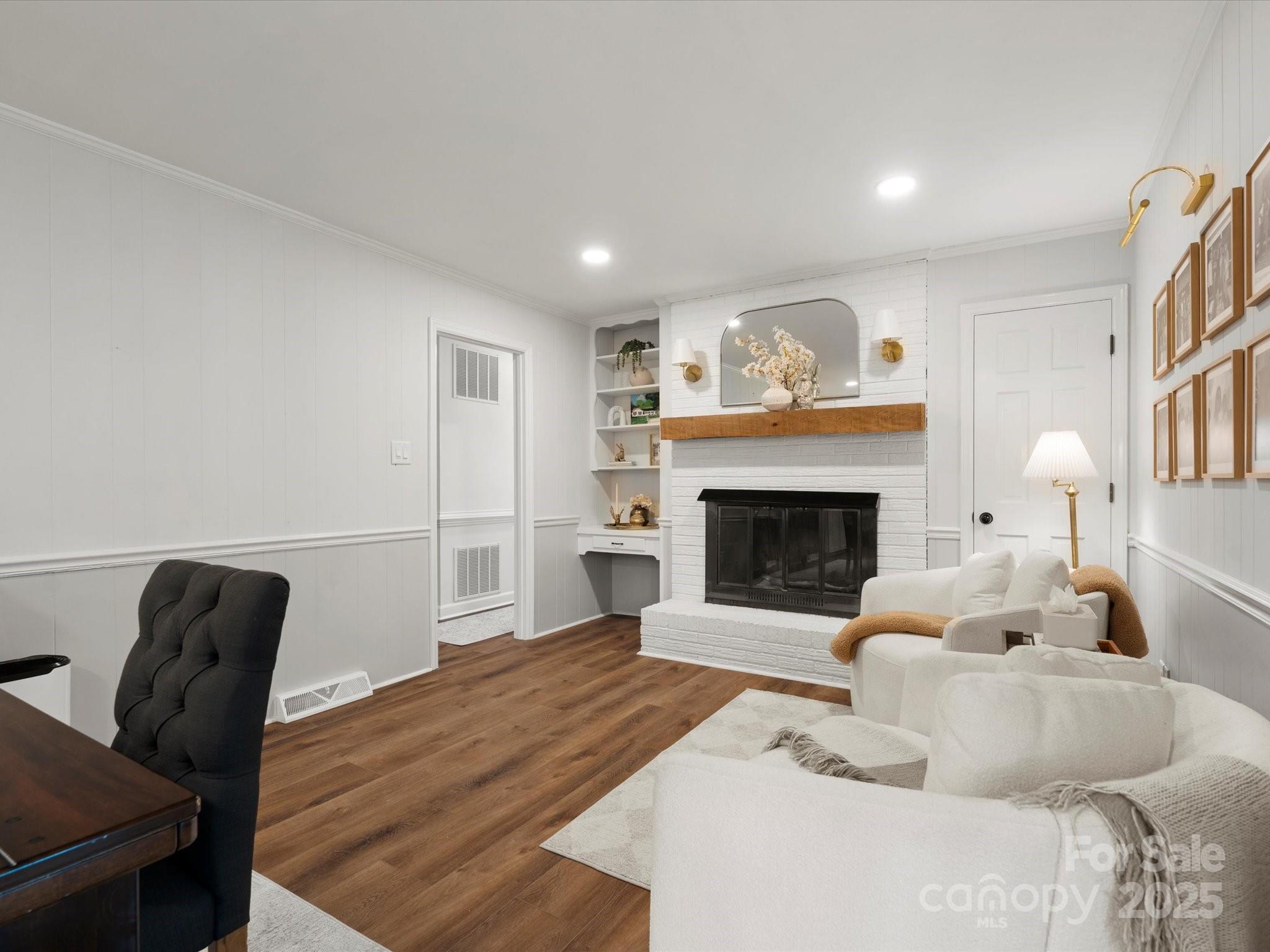 1102 Oak Hill Drive Monroe, NC 28112 - Photo 10 of 33 a living room with furniture and a fireplace