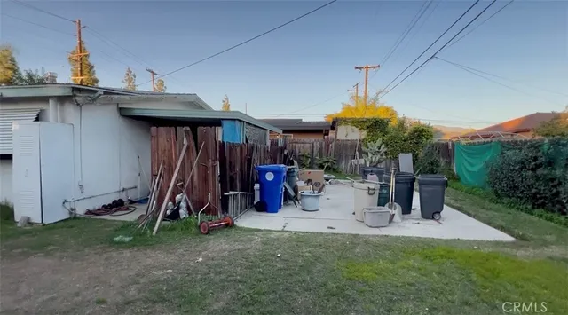 a view of a house with patio and a slide