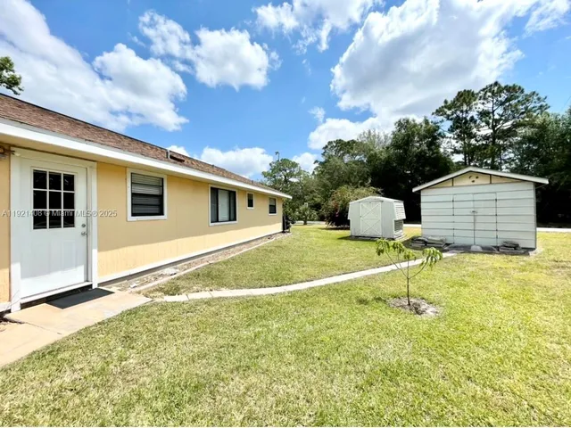 a house view with a backyard space