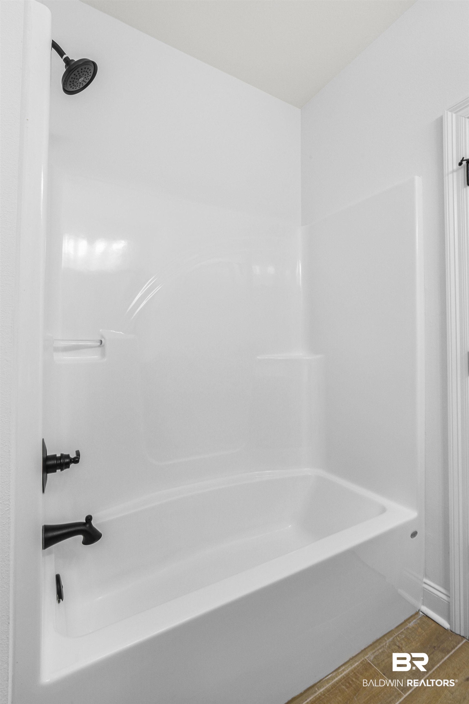 9855 Chipper Lane Foley, AL 36535 - Photo 23 of 48 Bathroom with wood-type flooring and bathtub / shower combination