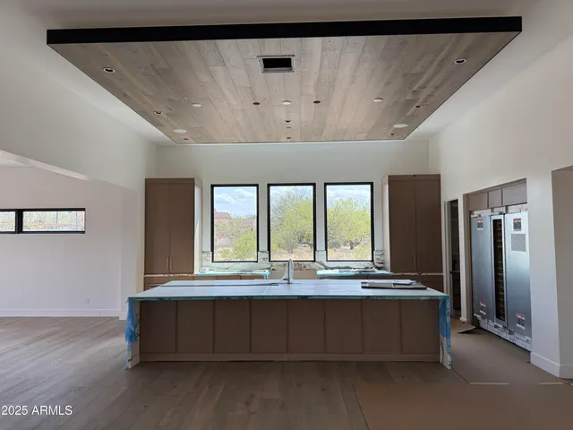 an empty room with windows and view