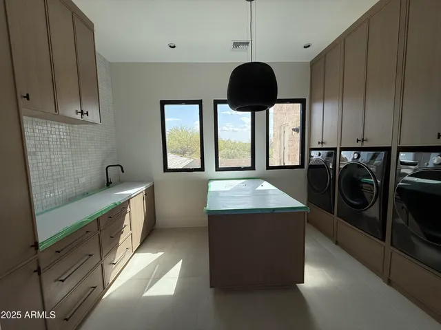 a utility room with cabinets