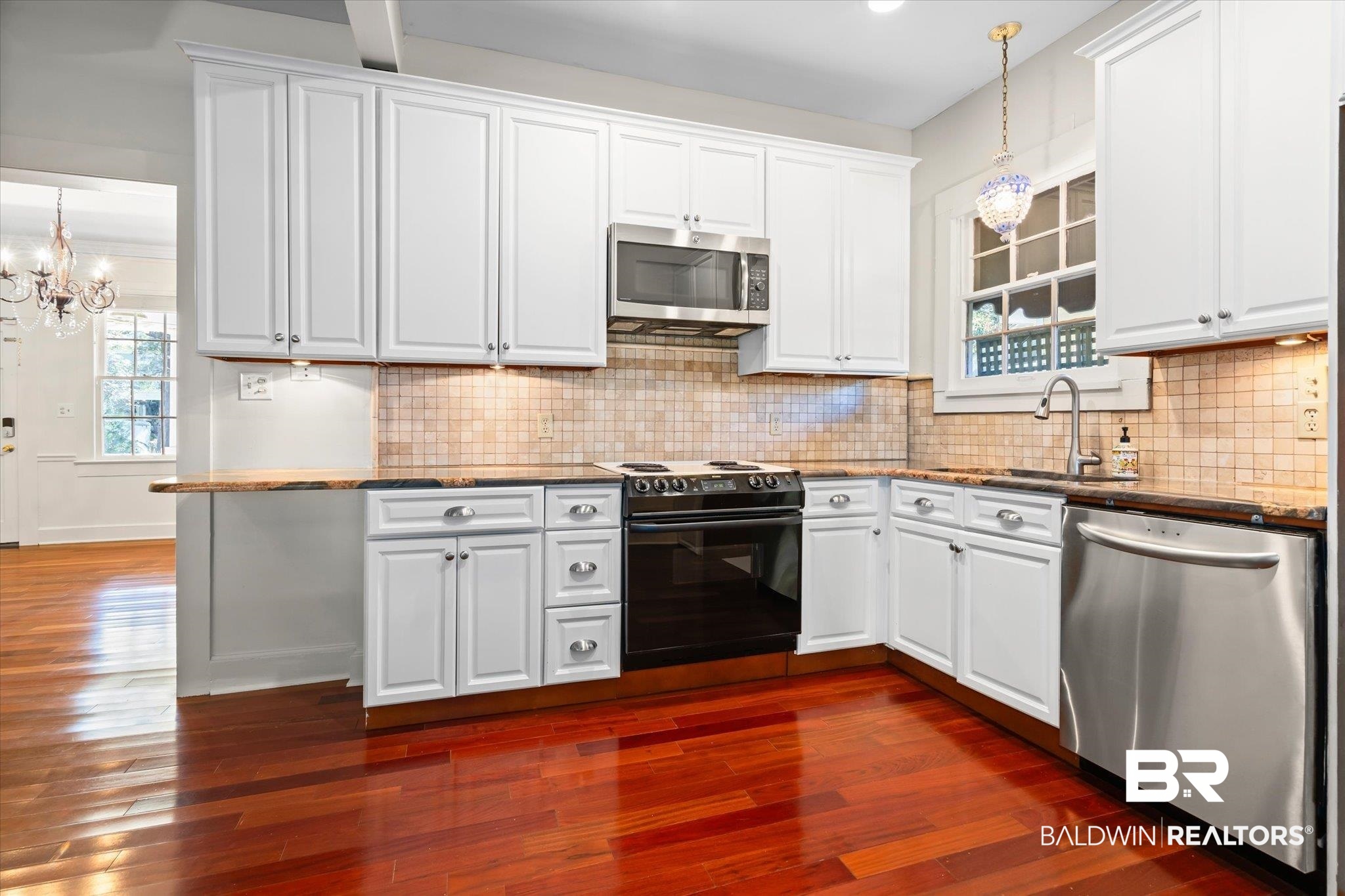 1220 Elmira Street Mobile, AL 36604 - Photo 5 of 20 Kitchen featuring white cabinetry, stainless steel appliances, and dark wood-type flooring