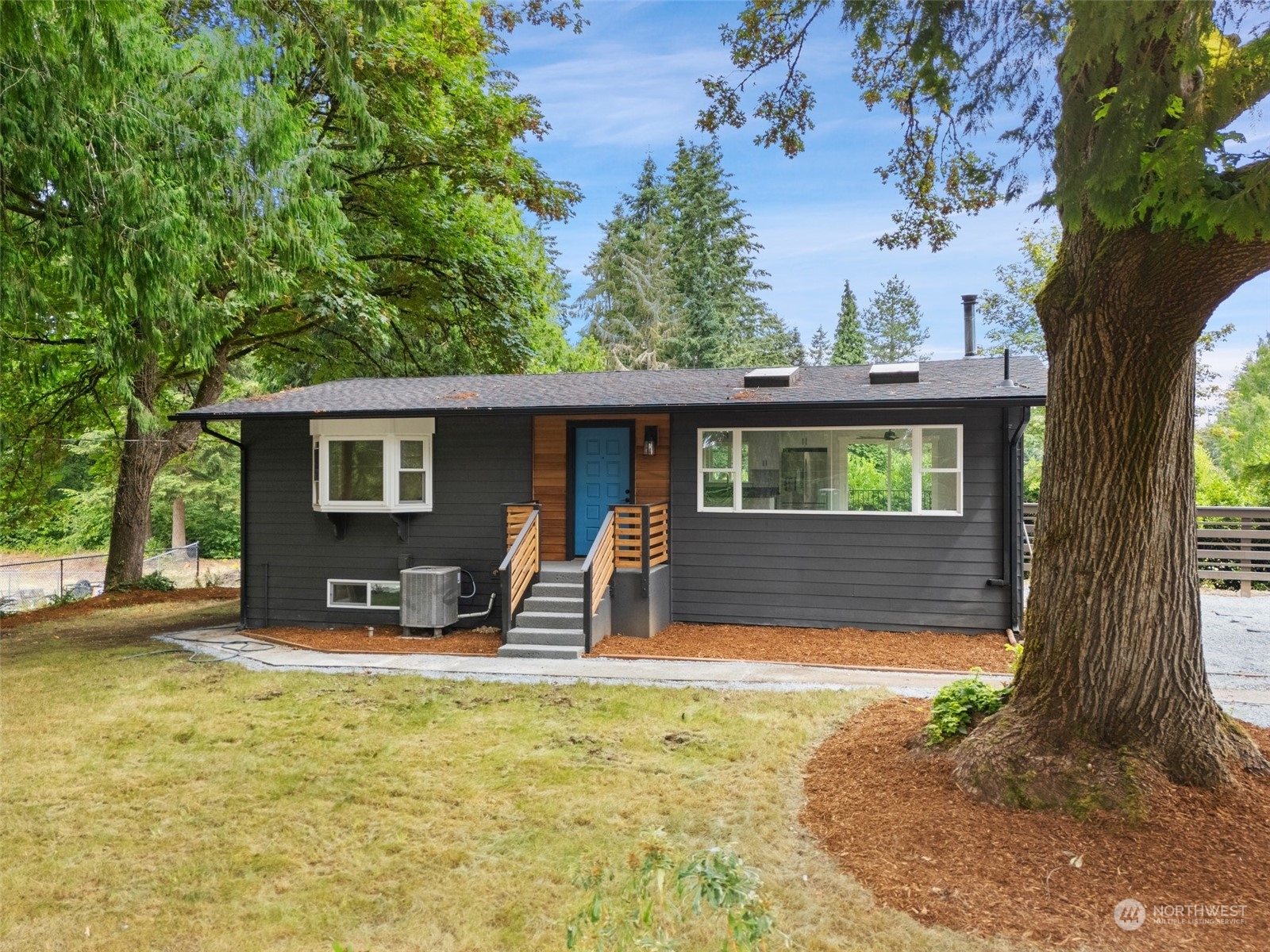 a view of a house with backyard porch and sitting area