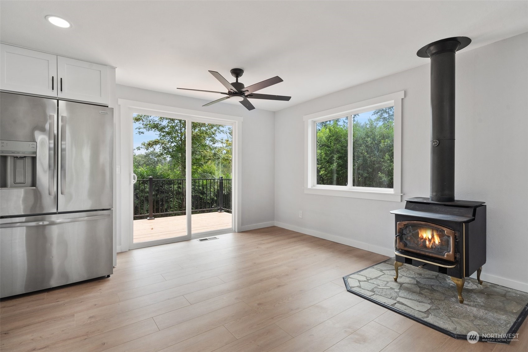18832 196th Avenue Southeast Renton, WA 98058 - Photo 13 of 33 a kitchen with stainless steel appliances granite countertop a refrigerator a stove a sink and a window