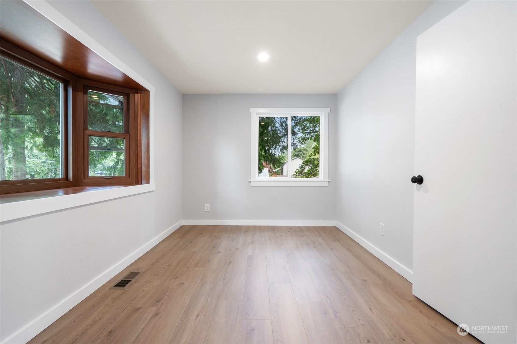 18832 196th Avenue Southeast Renton, WA 98058 - Photo 20 of 33 an empty room with wooden floor and windows