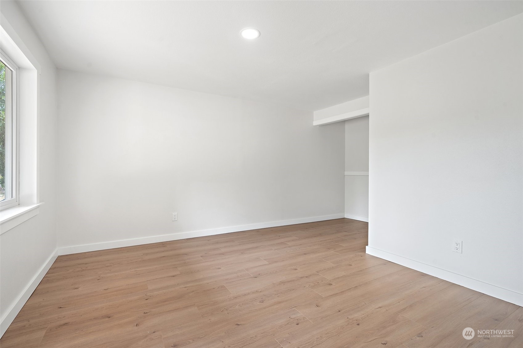 18832 196th Avenue Southeast Renton, WA 98058 - Photo 21 of 33 an empty room with wooden floor and windows