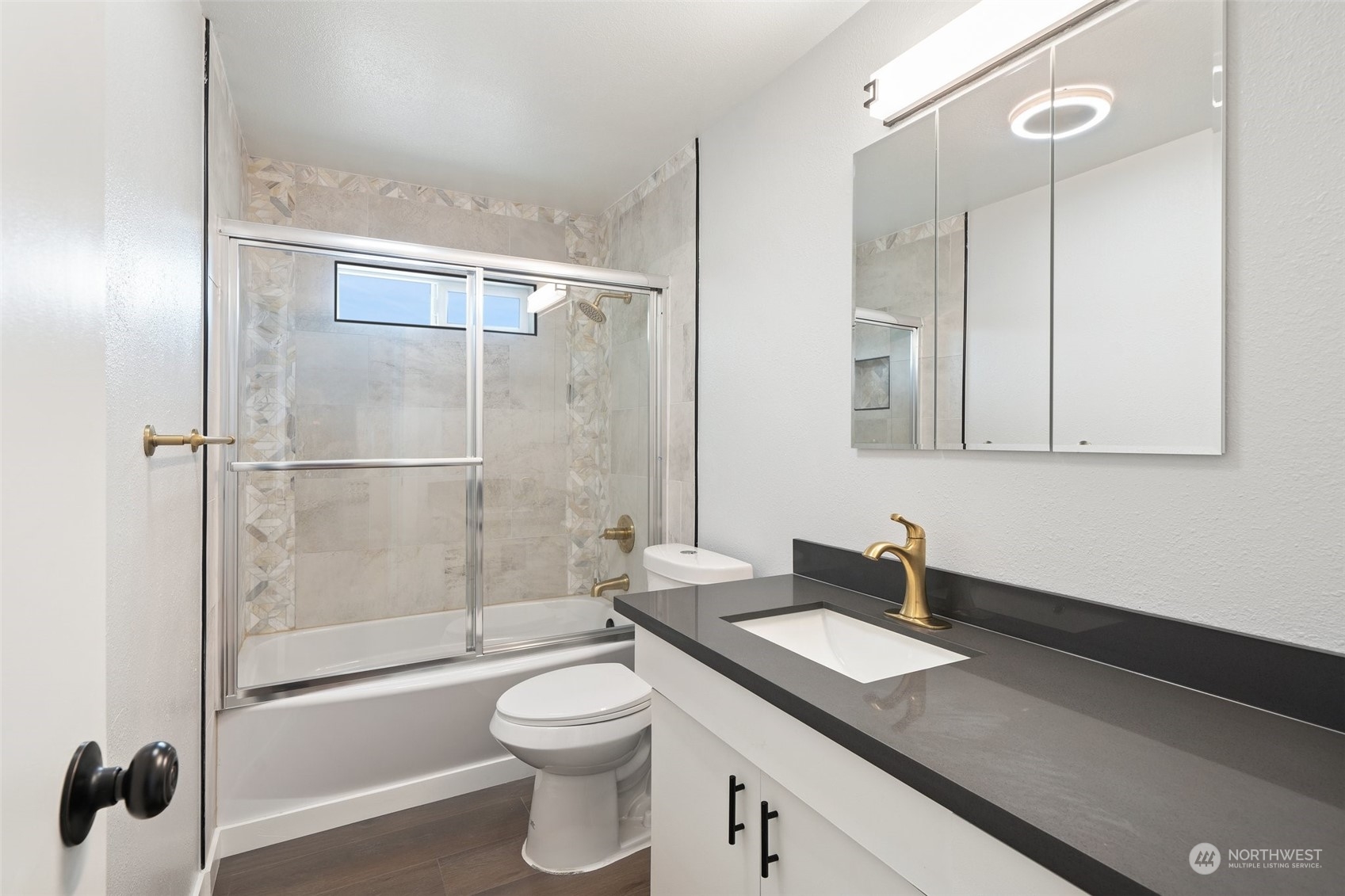 18832 196th Avenue Southeast Renton, WA 98058 - Photo 23 of 33 a bathroom with a granite countertop sink toilet and shower