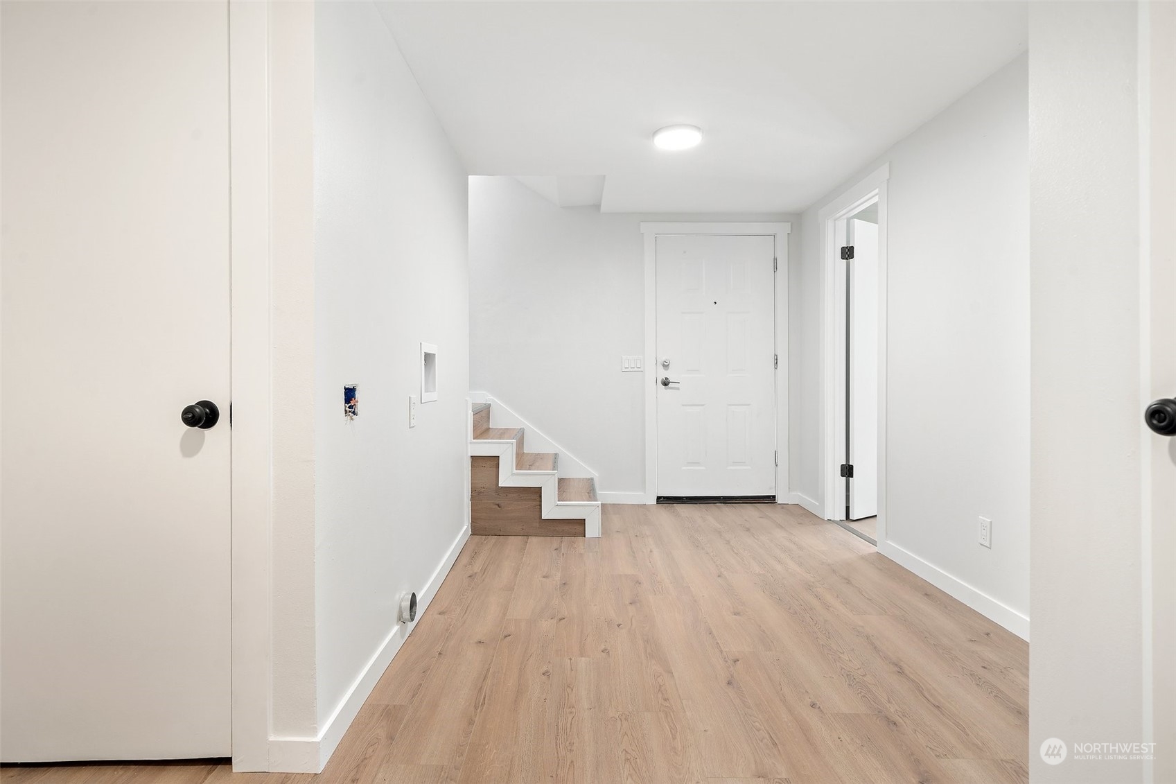 18832 196th Avenue Southeast Renton, WA 98058 - Photo 25 of 33 a view of a hallway with wooden floor and closet