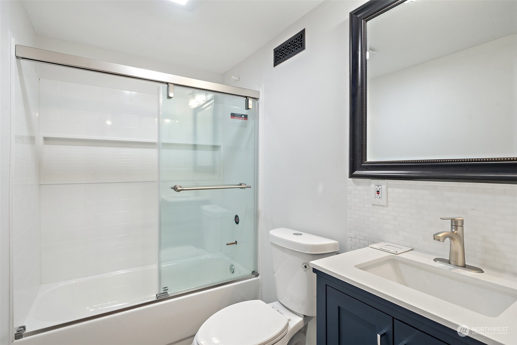 18832 196th Avenue Southeast Renton, WA 98058 - Photo 26 of 33 a bathroom with a shower sink vanity mirror and toilet