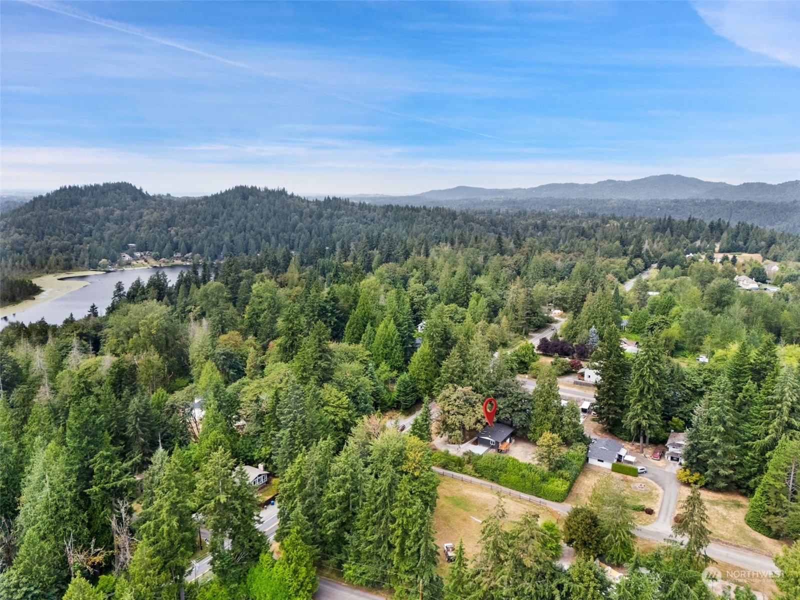 18832 196th Avenue Southeast Renton, WA 98058 - Photo 3 of 33 an aerial view of houses covered in trees