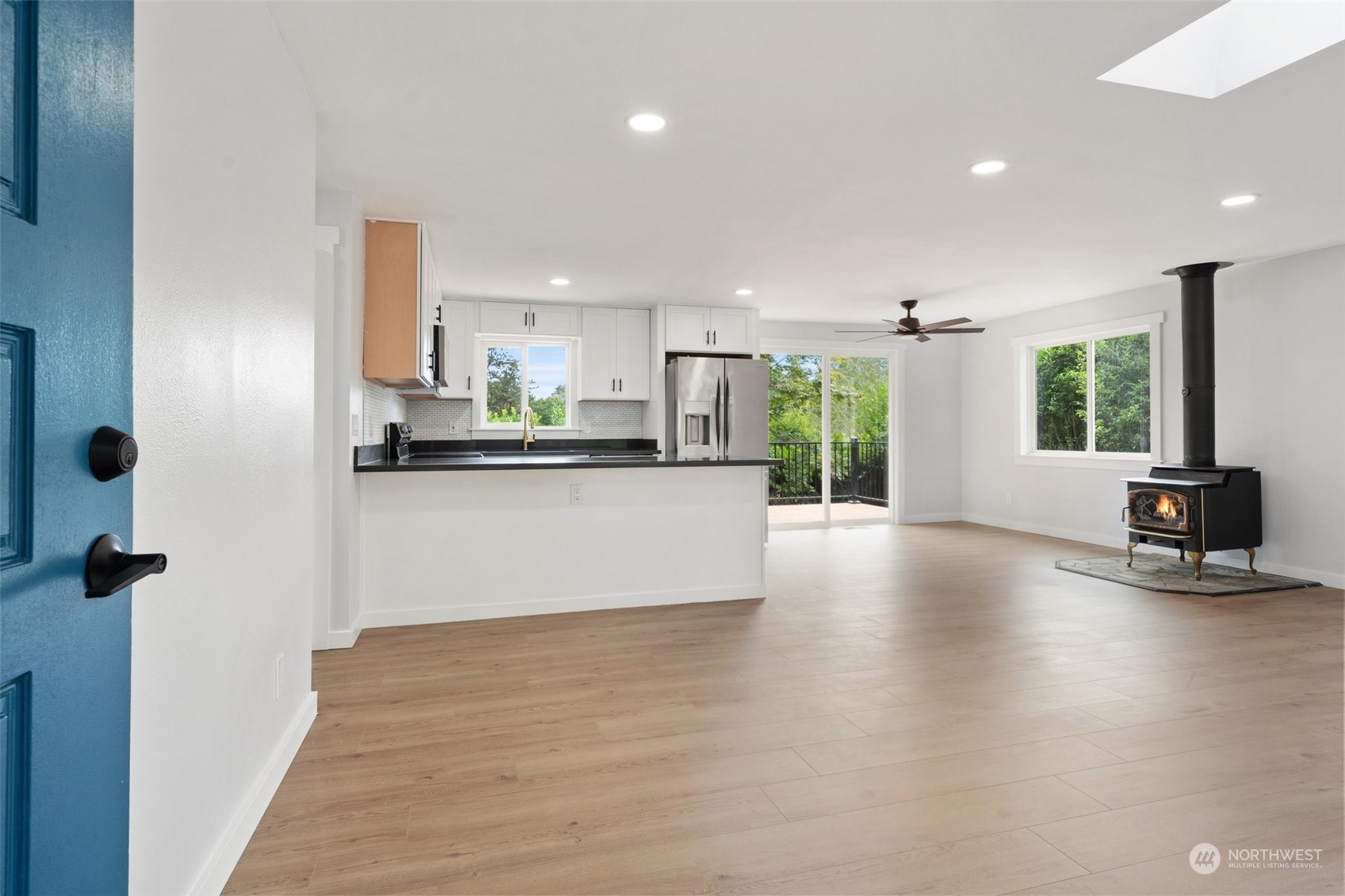 18832 196th Avenue Southeast Renton, WA 98058 - Photo 5 of 33 a kitchen with stainless steel appliances a refrigerator and a stove top oven