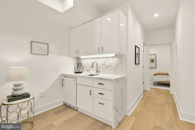 a bedroom with a bed with outer view and mirror