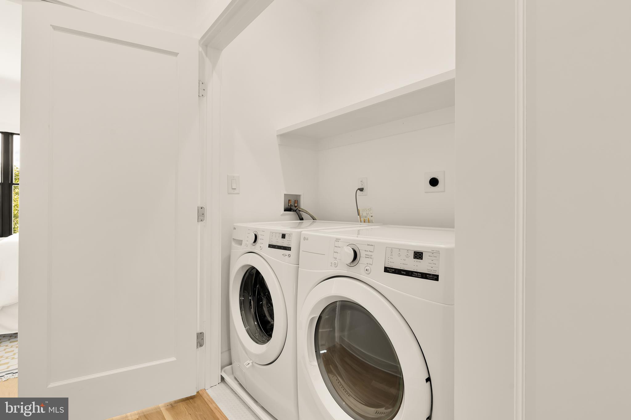 1205 10th Street Northwest, Unit 2 Washington, DC 20001 - Photo 29 of 32 a view of storage and utility room with washer and dryer