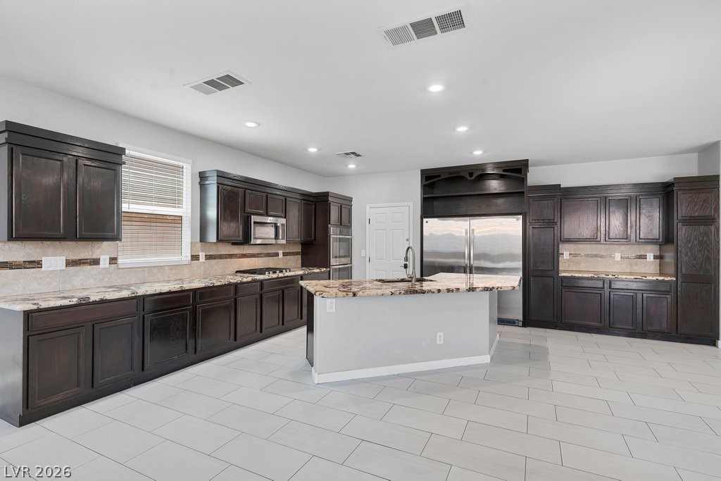 10336 Hawk Ravine Street Las Vegas, NV 89178 - Photo 12 of 59 Ample cabinetry and Double Refrigerator/Freezer.
