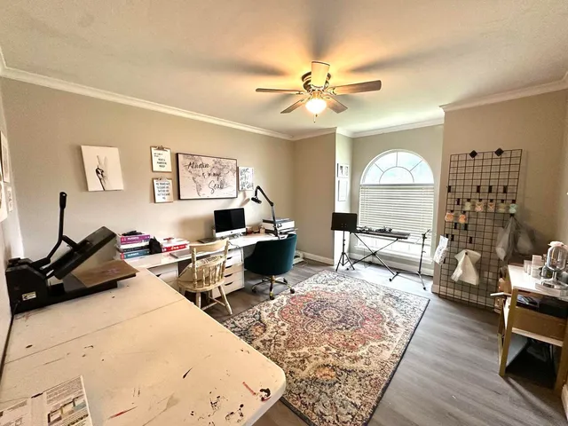 a living room with furniture a rug and a window