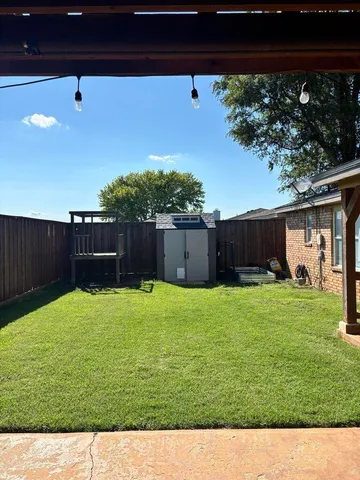 a view of a backyard with a garden