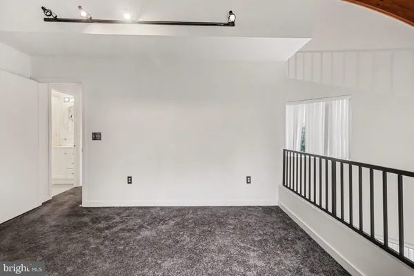 a view of a room with white walls