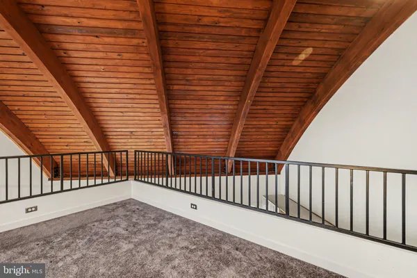 a view of balcony with wooden floor