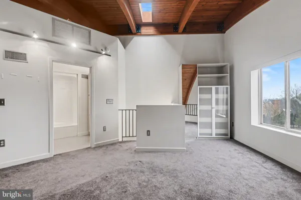a view of empty room with windows