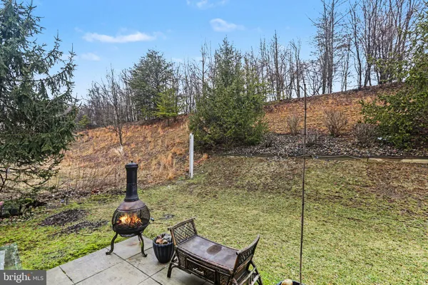a backyard of a house with barbeque oven