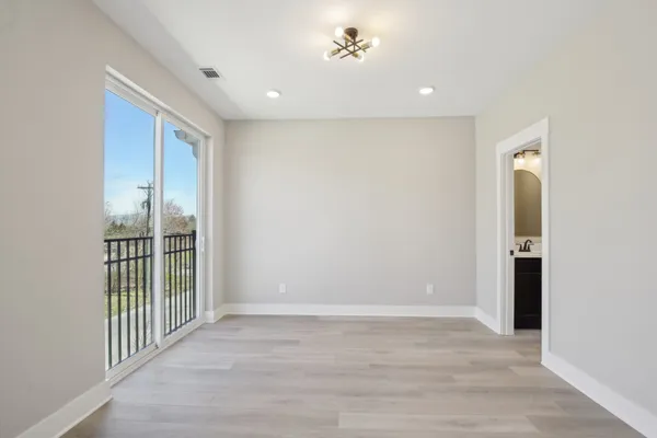a view of a hallway with a room