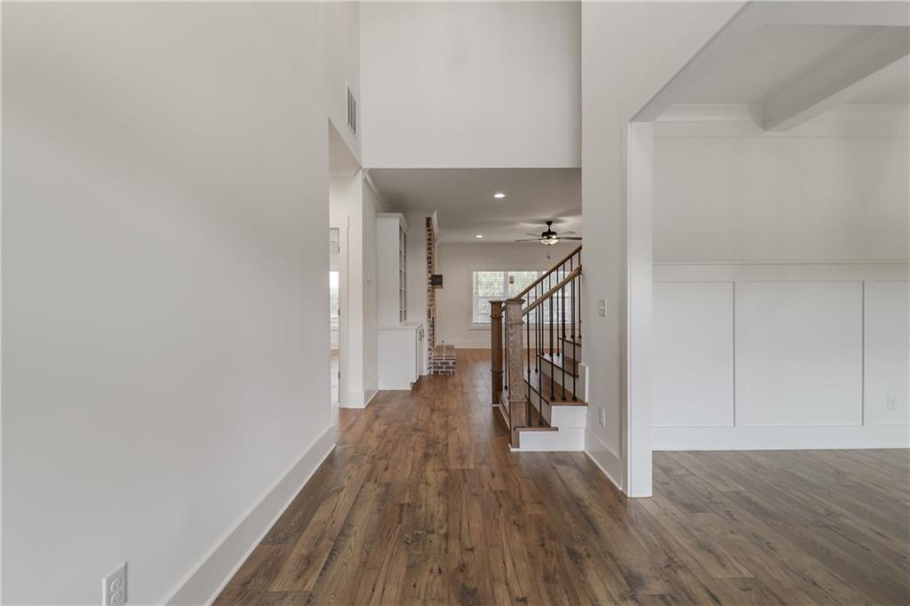 2113 Stonegate Way Monroe, GA 30656 - Photo 8 of 43 a view of hallway with wooden floor