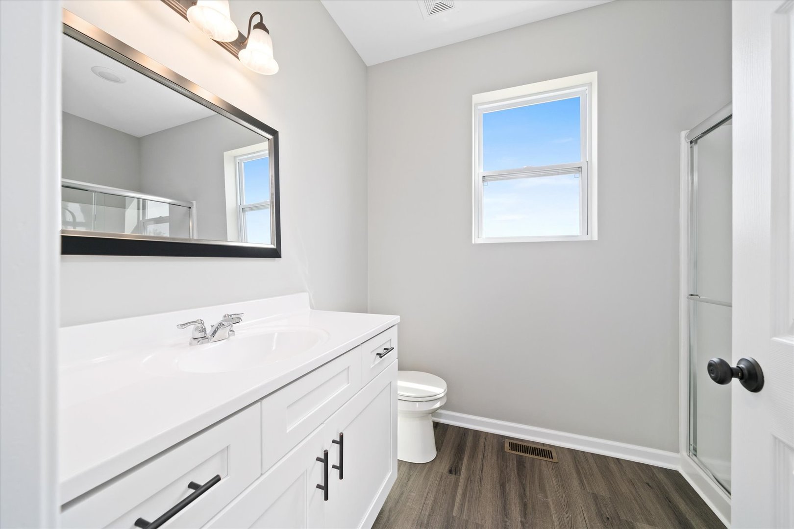427 Riverbend Drive Genoa, IL 60135 - Photo 17 of 31 a bathroom with a sink a toilet and a mirror